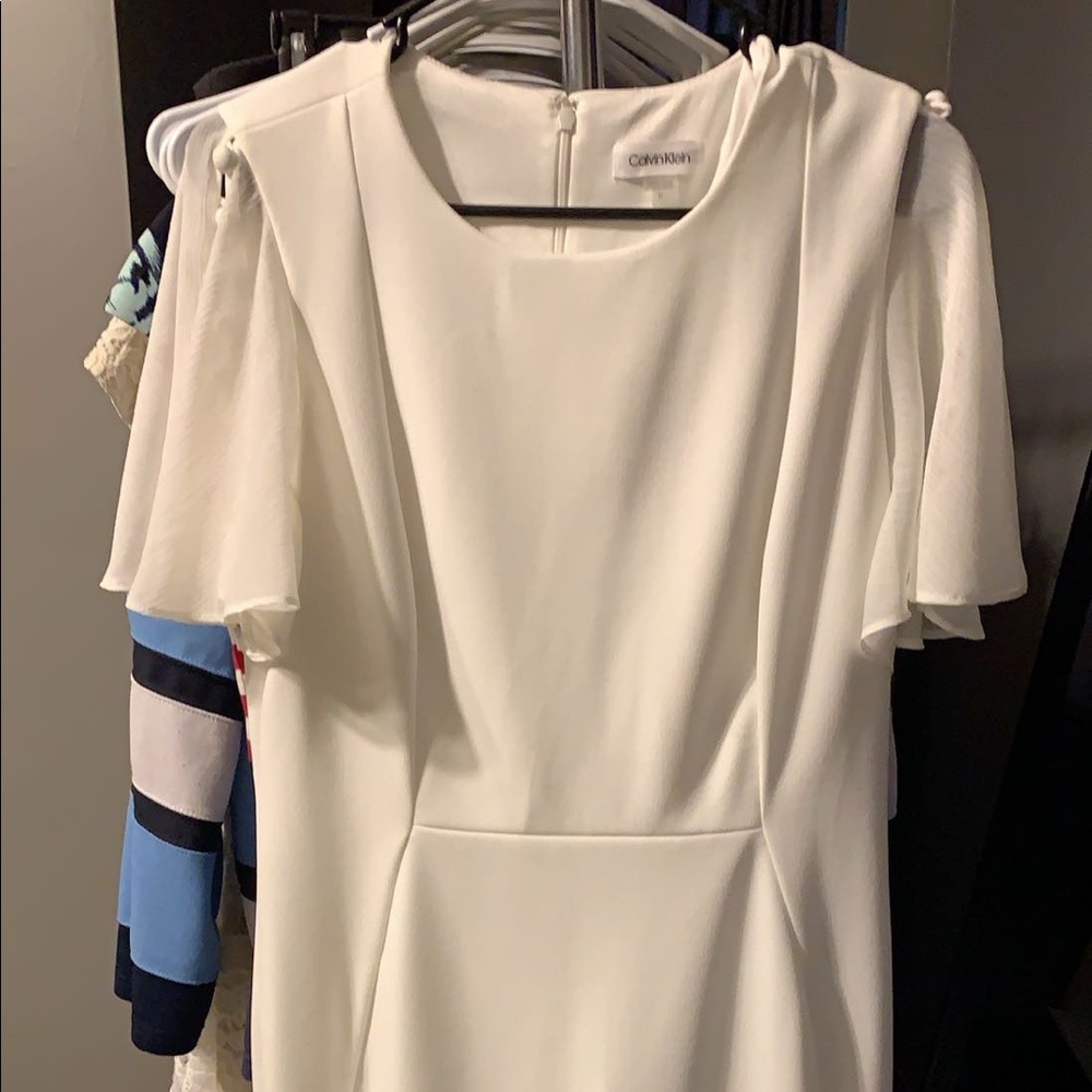 White Calvin Klein dress with sheer sleeves